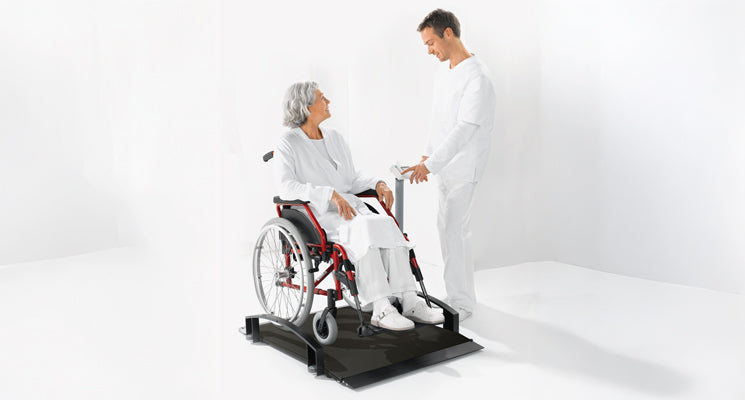 Seca 665 EMR-Validated Wheelchair Scale with person in wheelchair