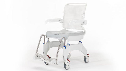 Side profile of Ocean Ergo shower commode chair with swing-away armrests and flip-up footplates