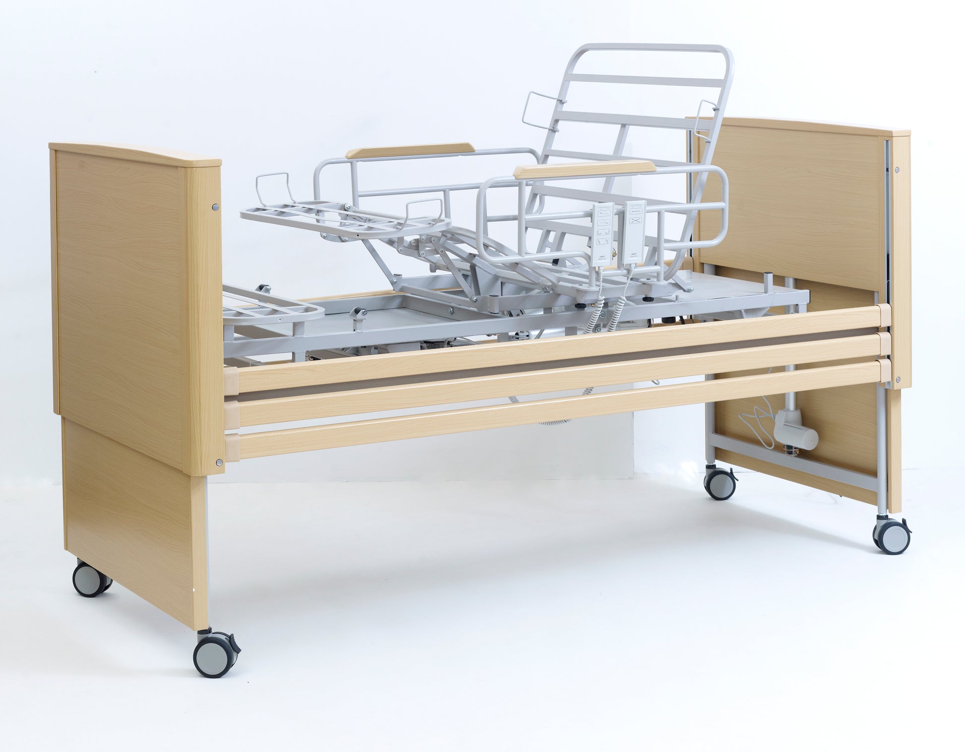 Hospital bed with wooden frame and metal components on a white background