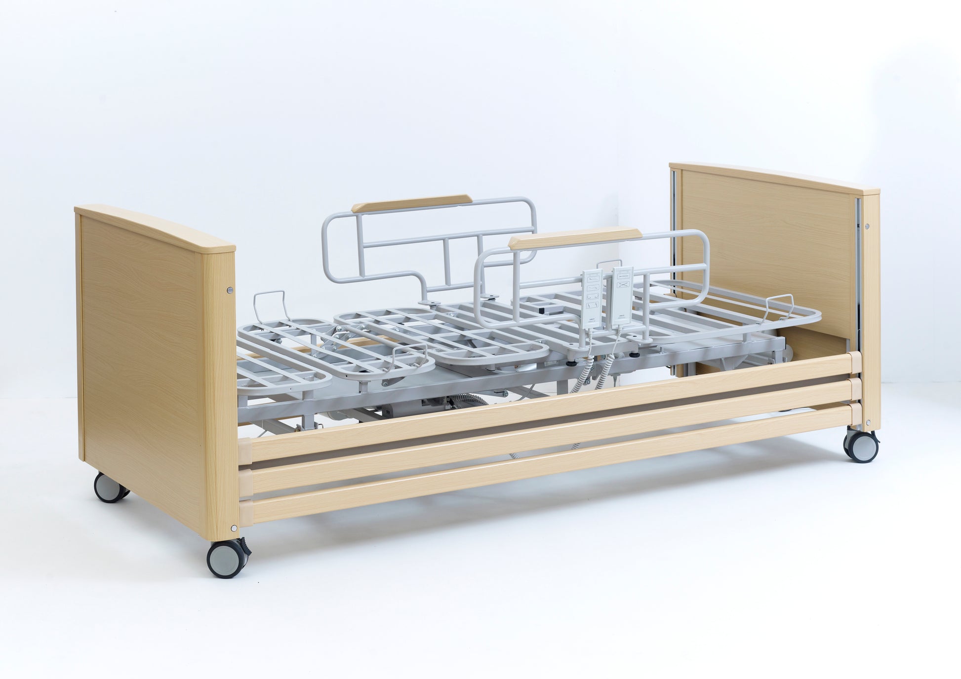 Hospital bed with wooden frame and metal components on a white background