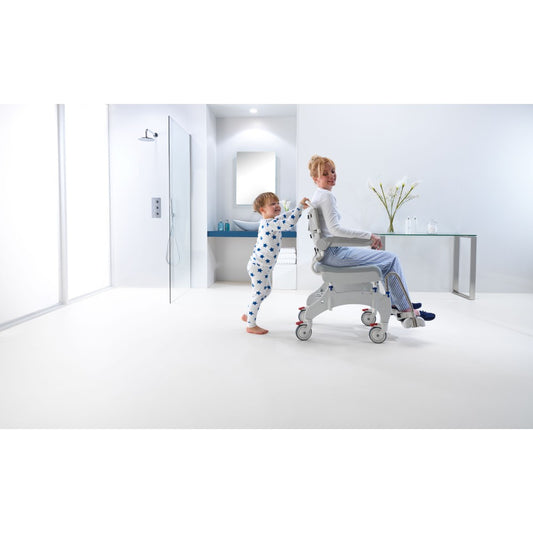 Side profile of the Invacare Aquatec Ocean Ergo XL Shower Commode showcasing adjustable footrests and armrests.