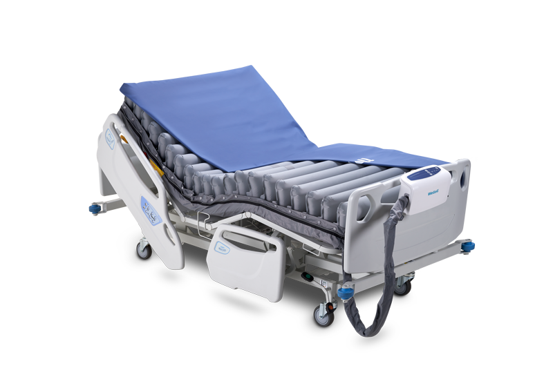 Wellell Domus Auto Bariatric alternating pressure mattress system displayed on a hospital bed.