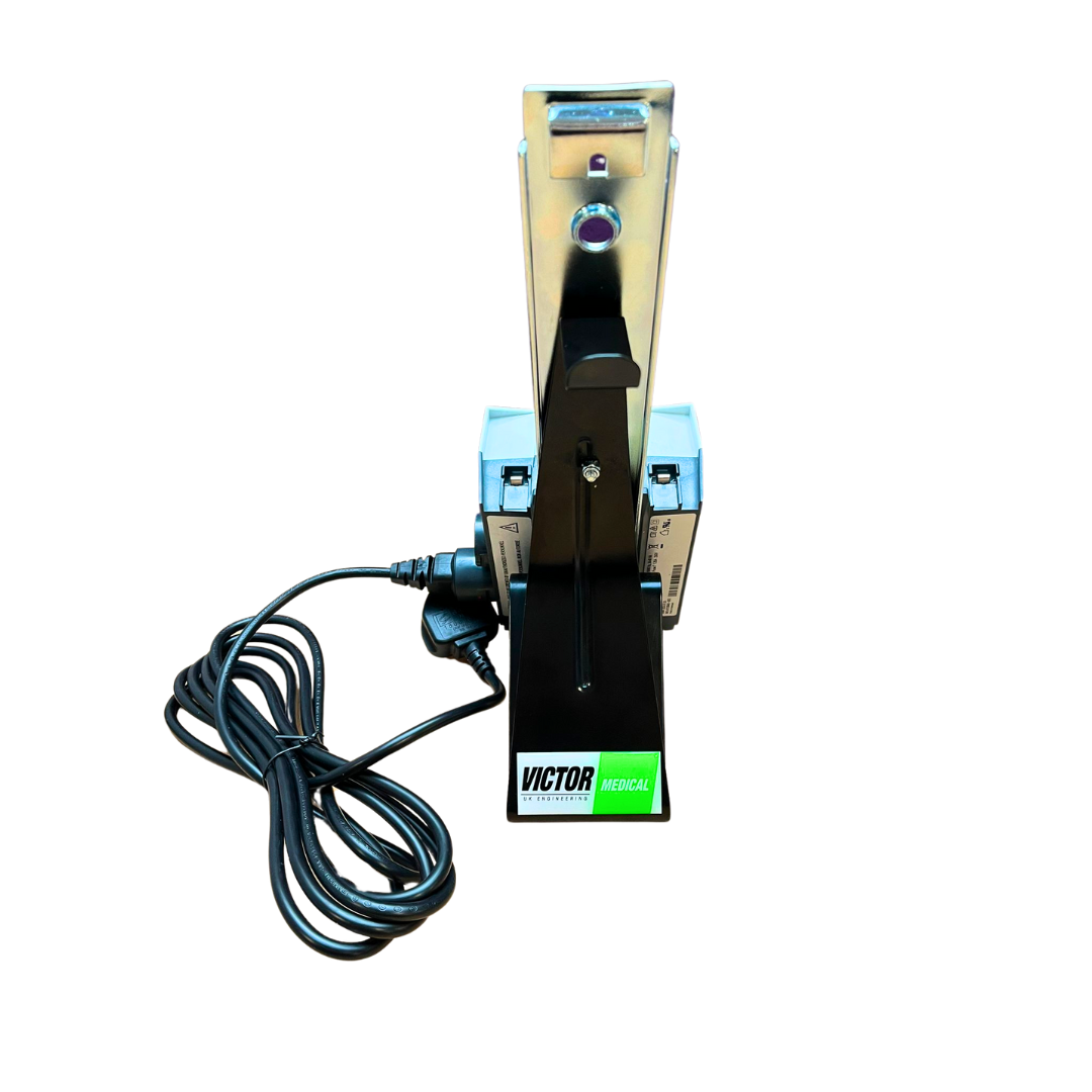 Hoist Battery Charger and Stand. Featuring the Victor Medical UK Logo. Compatible with Linak, Oxford,and Invacare Birdie Hoist and Stand Aid Batteries.