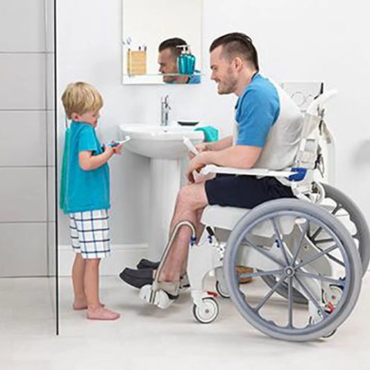 Invacare Aquatec Ocean Ergo XL Self-Propelled Shower Commode in use in a bathroom setting demonstrating its manoeuvrability.