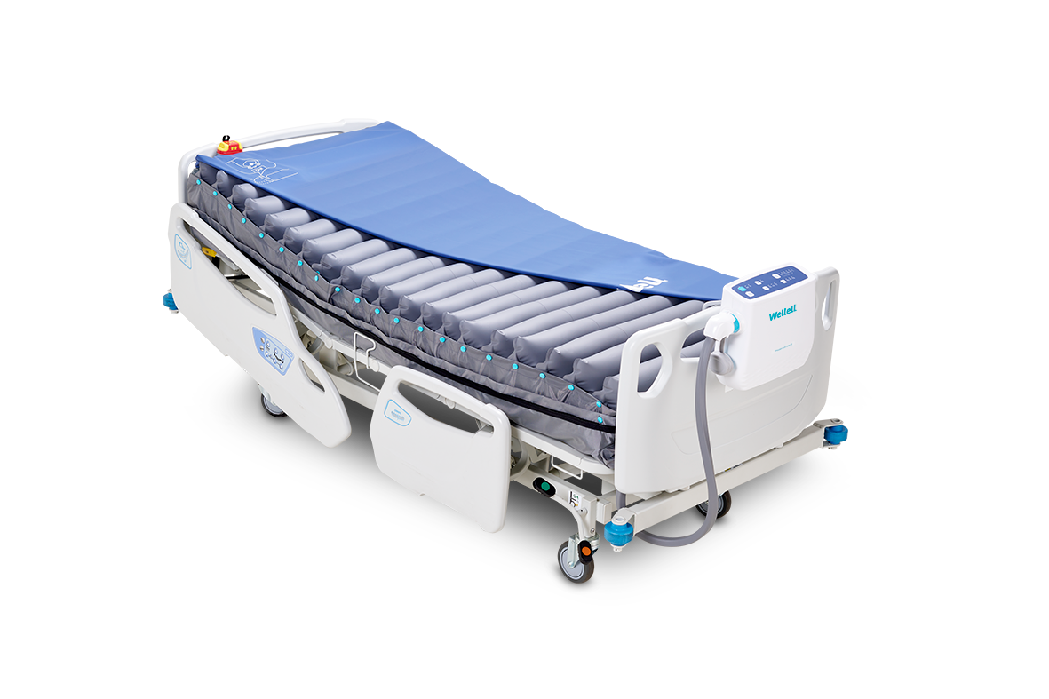 Procare Auto G3 alternating pressure mattress installed on a hospital bed, showing the full air cell top layer.