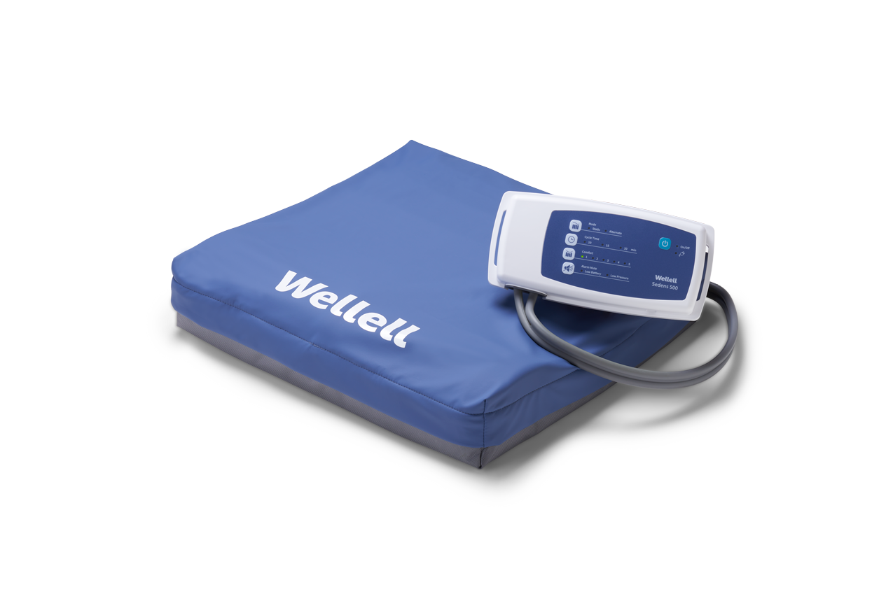 Wellell Sedens 500 dynamic seat cushion on adjustable chair, showing air cell surface and top cover.