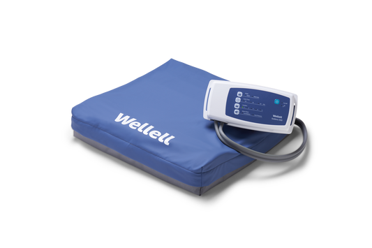 Wellell Sedens 500 dynamic seat cushion on adjustable chair, showing air cell surface and top cover.