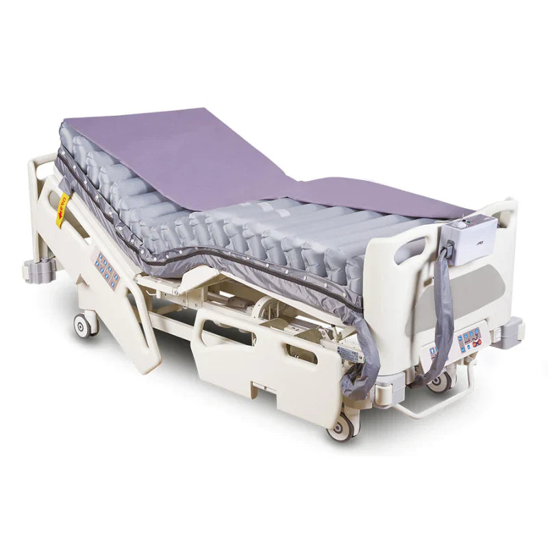 Wellell Verso pressure redistribution mattress displayed on a profiling care bed.