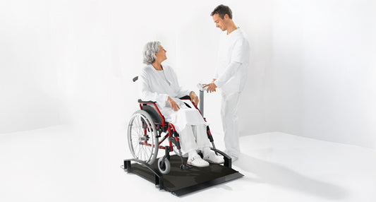 Seca 665 EMR-Validated Wheelchair Scale with person in wheelchair
