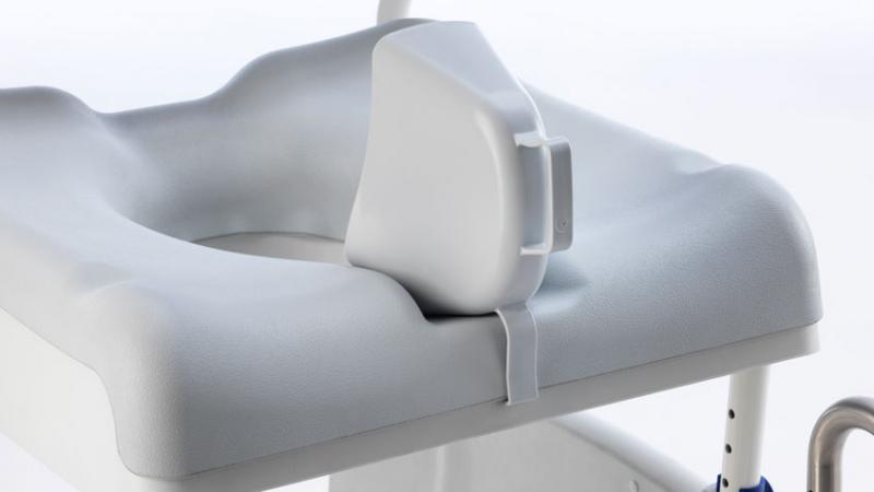 Removable commode pan with support rails on Aquatec Ocean Ergo shower commode chair