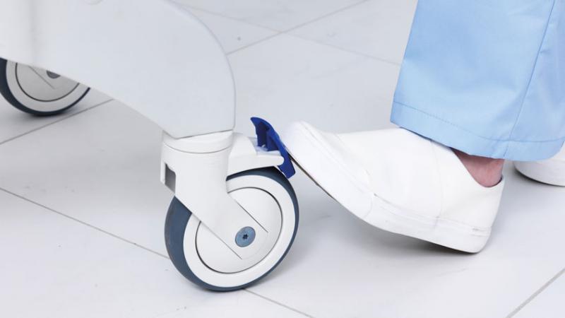 Adjustable flip-up footrests with heel loops on Ocean Ergo shower chair