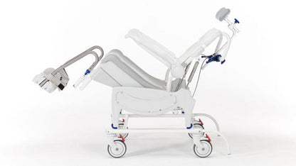 Detail of the tilt-in-space mechanism on the Invacare Aquatec Ocean VIP Ergo Shower Commode demonstrating its range of motion.