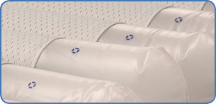 Close-up of individual air cells in the Apollo Aura mattress, featuring low air loss perforations for moisture control
