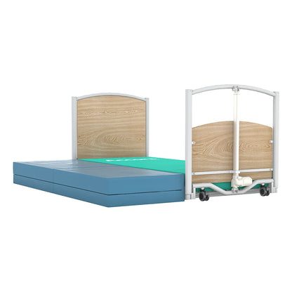 Accora FloorBed 1 lowered to the floor with a crash mat next to the bed