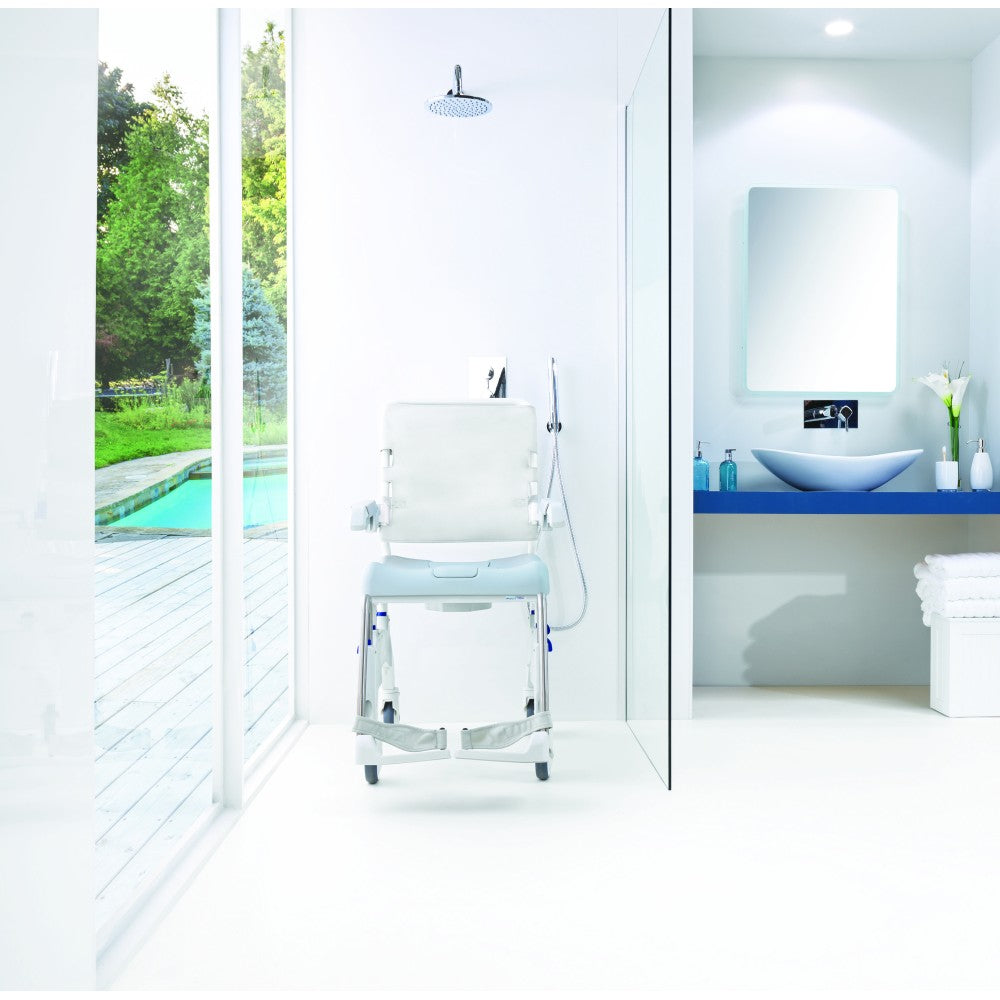 Invacare Aquatec Ocean Ergo XL Shower Commode in use in a bathroom setting demonstrating its manoeuvrability.