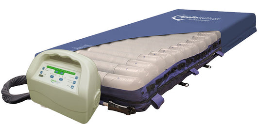 Apollo Aura low air loss pressure relief mattress with digital pump and breathable top cover partially opened to show air cells