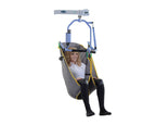 Oxford Comfort Sling fitted on a 4-point positioning cradle hoist, supporting user’s full body during passive transfer.