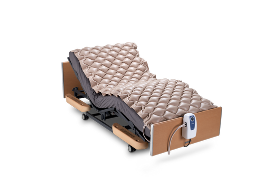 Wellell Domus 1 alternating pressure mattress overlay displayed on a standard hospital bed.