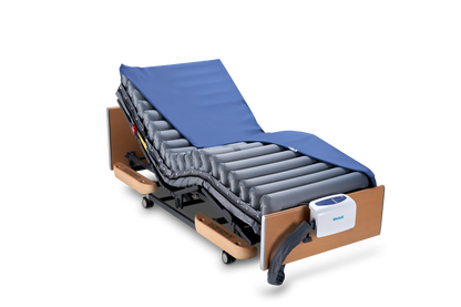 Domus 4 V2 dynamic pressure relief mattress system with digital pump in care home bedroom.