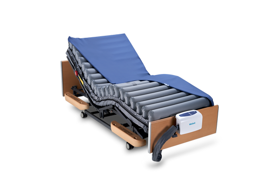Domus 4 V2 dynamic pressure relief mattress system with digital pump in care home bedroom.