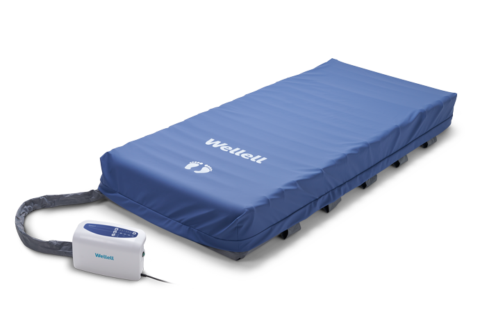 Heel relief zone with adjustable air cells for targeted pressure offloading.