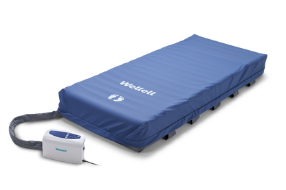 Heel relief zone with adjustable air cells for targeted pressure offloading.
