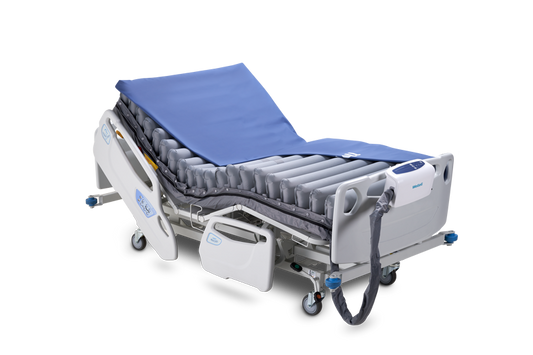 Wellell Domus Auto Bariatric alternating pressure mattress system displayed on a hospital bed.