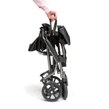 Aluminium Lightweight Wheelchair Folded and being carried