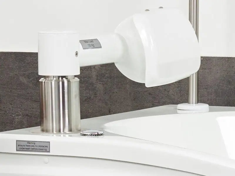 Astor Compact Plus assisted bath with tilt and spa options. Arm lifting mechanism.