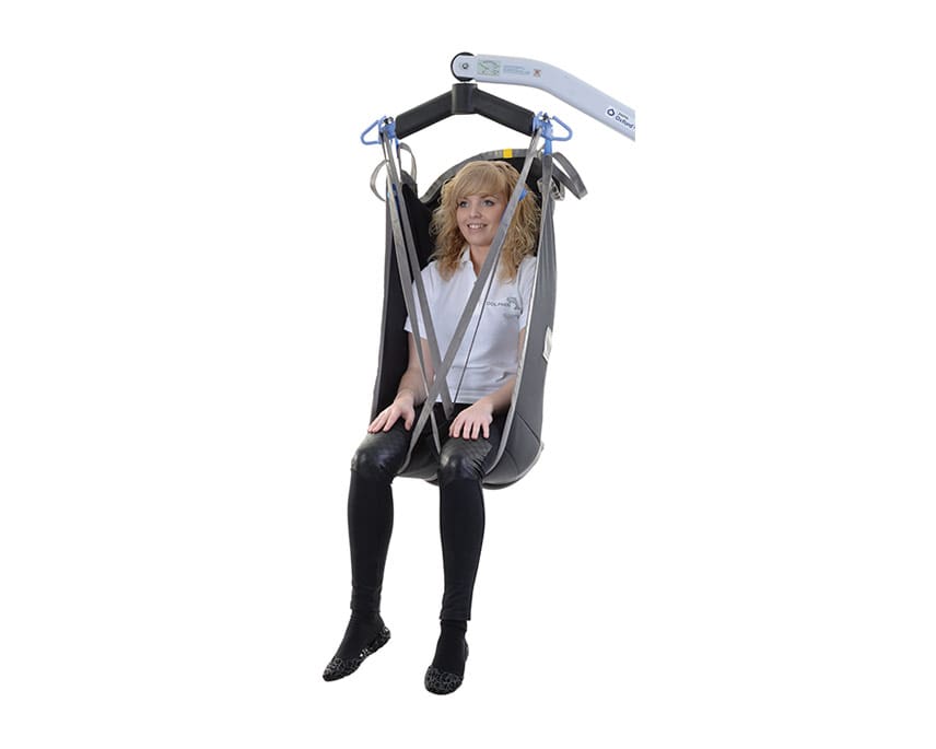 Oxford High Back Sling in use with hoist, supporting patient from seated position.