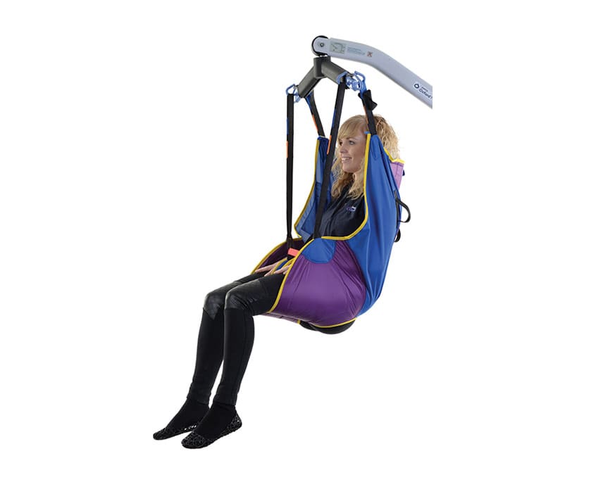 Oxford MultiFit Sling laid flat with deluxe paddle-style leg sections and loop attachments in use with a hoist.