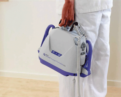 Oxford Voyager Portable Hoist being carried by a carer