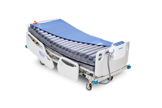 Procare Auto G3 alternating pressure mattress installed on a hospital bed, showing the full air cell top layer.