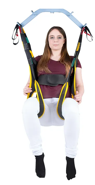 Wellell Quick Transfer Sling in use with patient during ground-level transfer, showcasing full-body support.