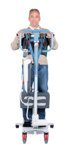 “Wellell Active Sling in use on an active hoist, showing user supported in padded sling with abdominal belt.