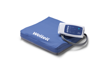 Wellell Sedens 500 dynamic seat cushion on adjustable chair, showing air cell surface and top cover.
