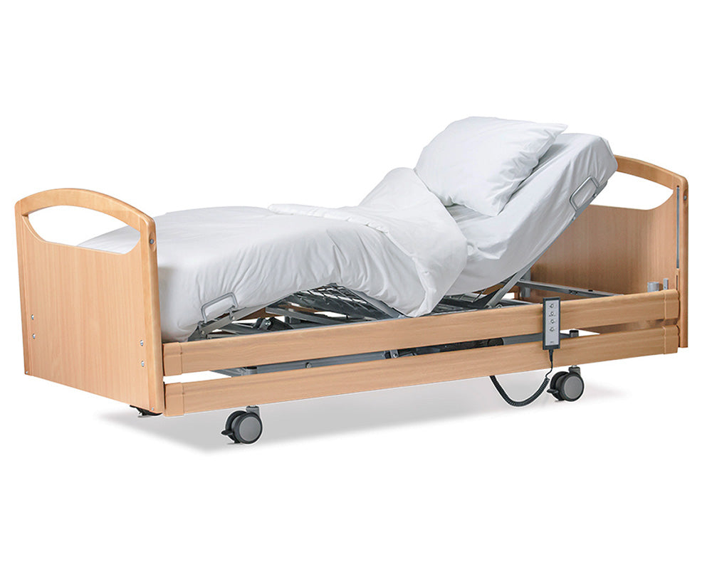 Wellell Pro-Care Wide Community Profiling Bed with beech timber siderails. Showing the head and leg rising feature.