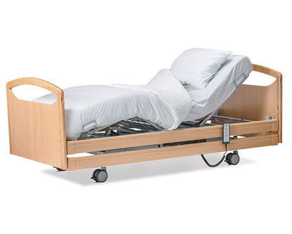 Wellell Pro-Care Wide Community Profiling Bed with beech timber siderails. Showing the head and leg rising feature.