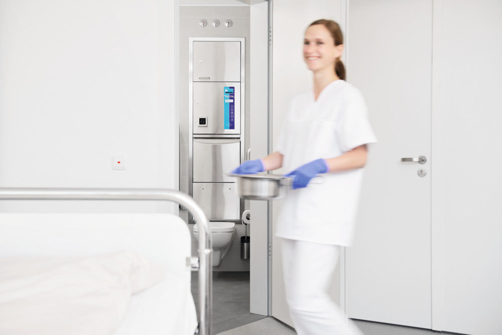 Meiko TopLine 30 freestanding washer-disinfector for care environments. Full view of the Topline 30 in a wall mounted position.