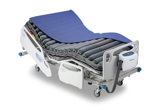 Wellell Pro-care Auto Bariatric Mattress System displayed on a hospital bed.