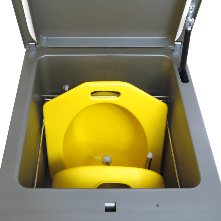 Bedpanwasher/Disinfector Compact Superior 2 showing toilet seats inside the machine.