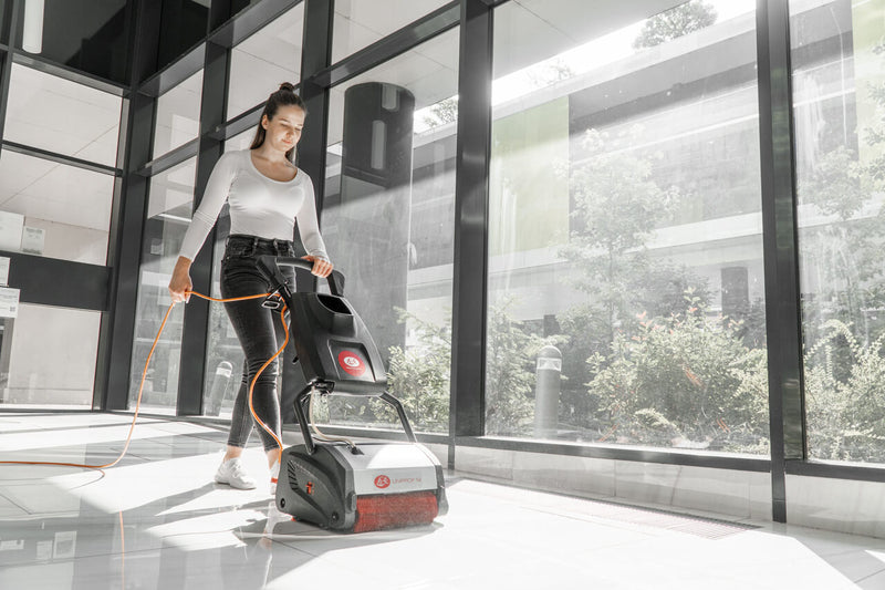 Lux Uniprof M being used to clean the floor of an office building
