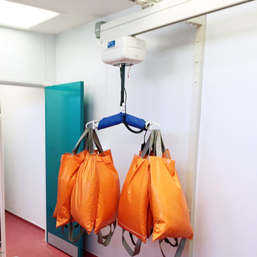 Some of our 24 NRG Group Multi-Purpose Weight Testing Bags - PRE-ORDER in use during a LOLER inspection test on a ceiling hoist.